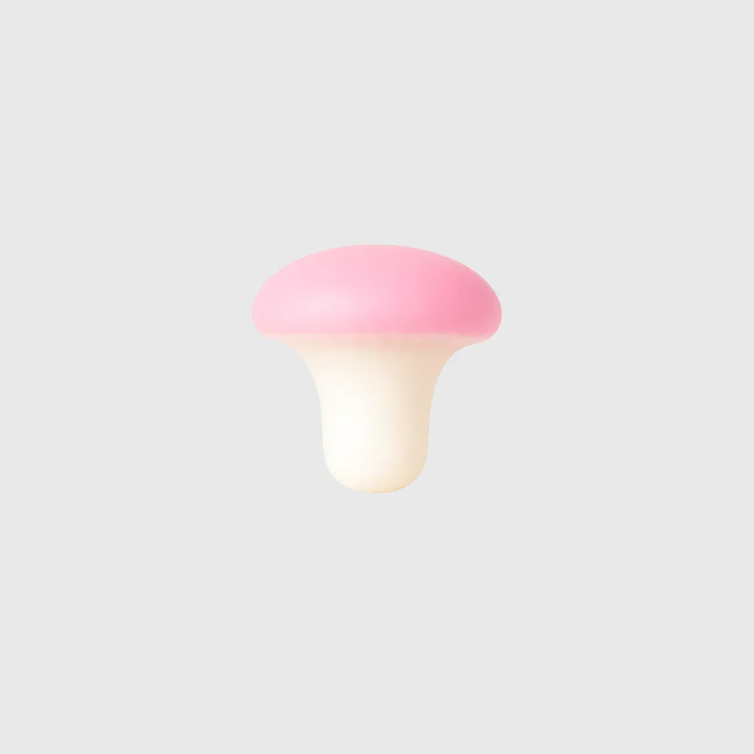 Rosa Pilzform mit cremefarbenem Stiel, minimalistisch und stilvoll gestaltet